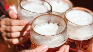 People cheering beer.