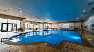 View Of The Indoor Pool With Tables And Chairs Located At Horseshoe Southern Indiana