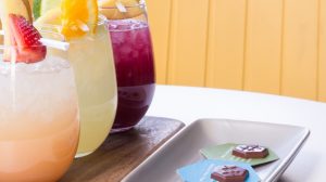Three cocktails and chocolates.