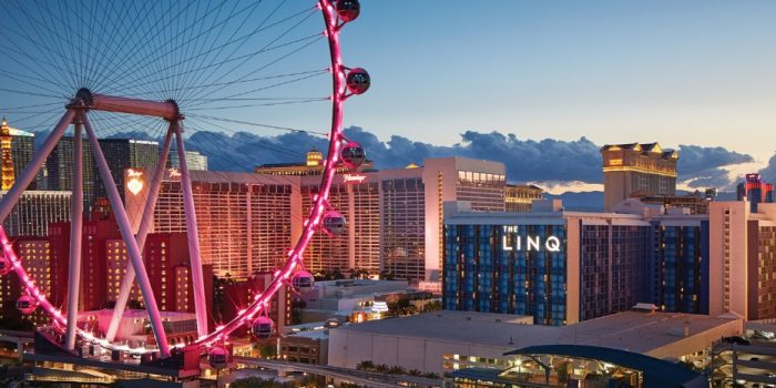 View Of The Linq Las Vegas Promenade With The High Roller In The Back Ground At Night With The Best Of Las Vegas Log In The Corner View Of The Linq Las Vegas Promenade With The High Roller In The Back Ground At Night With The Best Of Las Vegas Log In The Corner