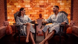 Couple sitting in salt spa cave at The LINQ Spa