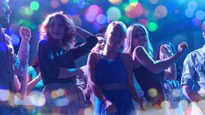 Ladies dancing on a dance floor.