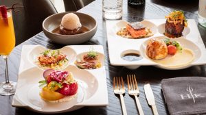 Summer sampler dishes on a table at Hell's Kitchen by Gordon Ramsay