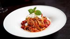Spaghetti with tomato sauce, mozzarella, and basil.