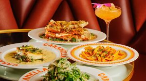 Entrees and Cocktail on Glass Table at Caramella at Planet Hollywood Las Vegas