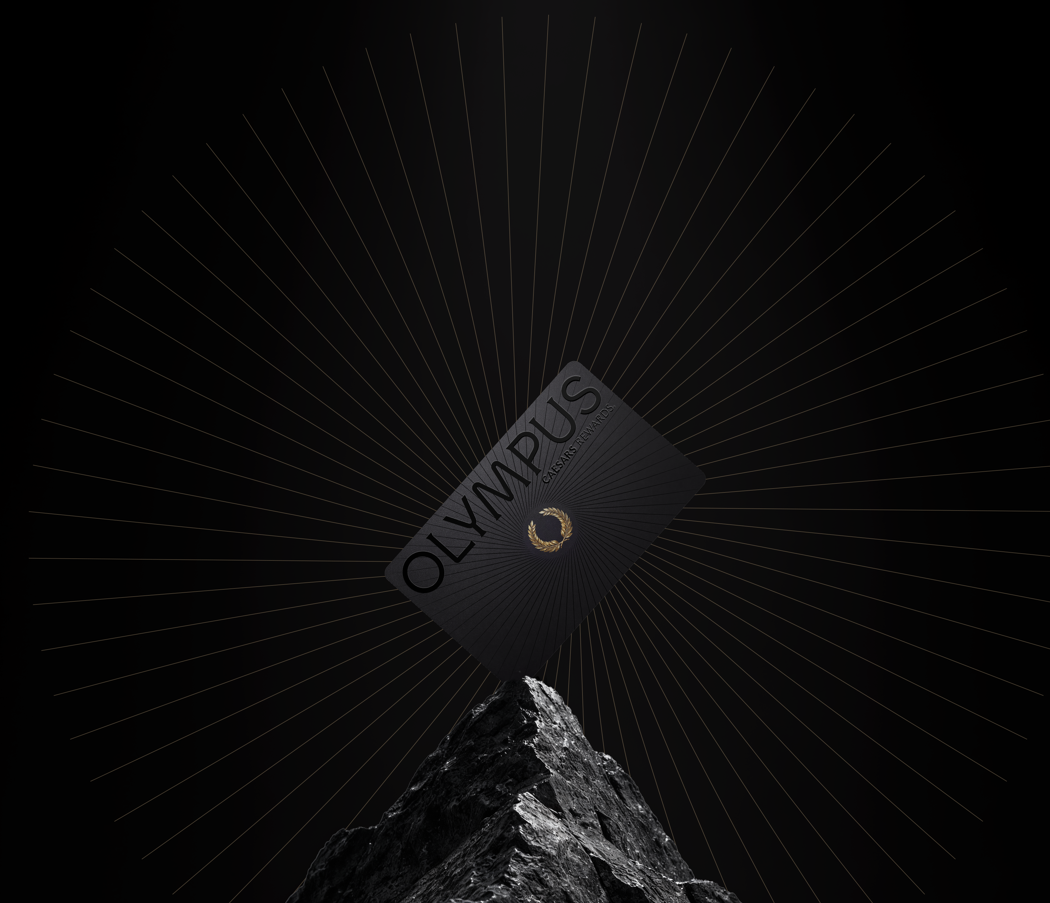 Olympus Caesars Rewards black membership card with a gold laurel emblem above a mountain peak, the highest tier of Caesars Rewards